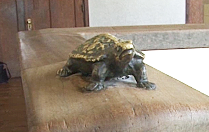 The banister rails are decorated with the brass figure of a turtle competed with a rabbit.
