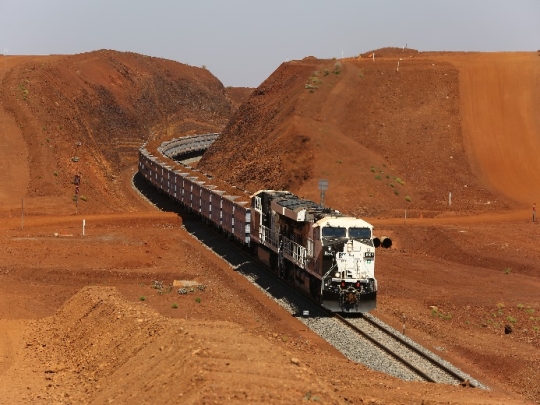 [ Roy Hill rail transporting iron ore ]